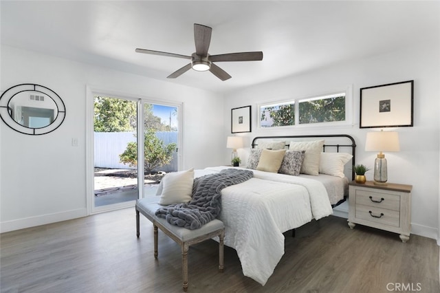 bedroom featuring baseboards, wood finished floors, a ceiling fan, and access to outside