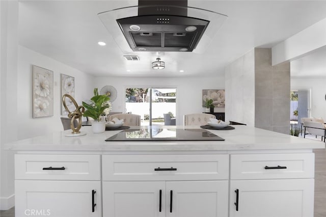 bar featuring visible vents, recessed lighting, ventilation hood, and black electric stovetop