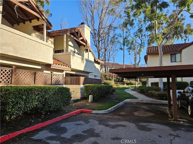 surrounding community featuring covered parking