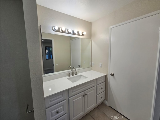 bathroom featuring tile patterned floors and vanity