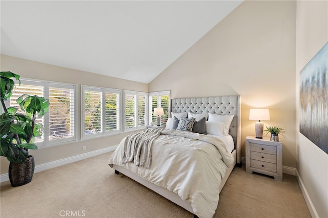 bedroom with baseboards, high vaulted ceiling, and carpet