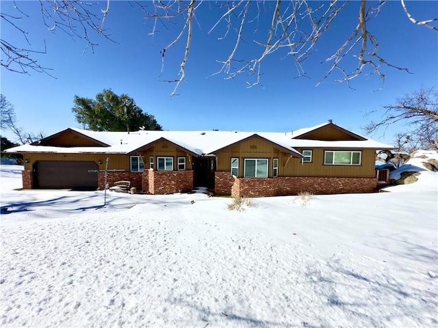 ranch-style home with brick siding and an attached garage