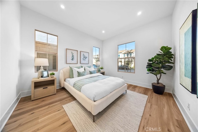 bedroom featuring light wood-style flooring, baseboards, and recessed lighting