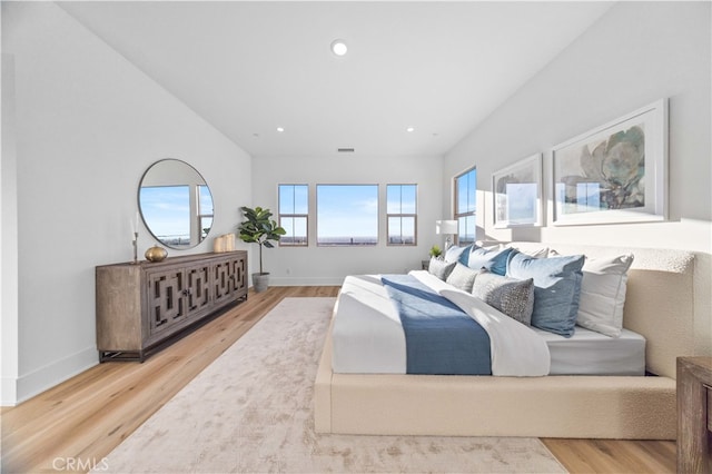 bedroom with recessed lighting, baseboards, and wood finished floors