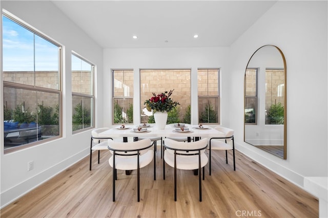 dining room with recessed lighting, light wood-style floors, and baseboards