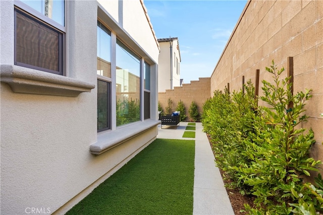 view of yard with a patio and a fenced backyard