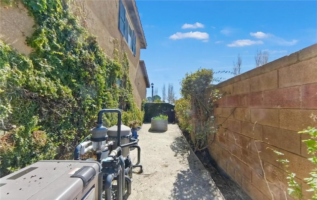 exterior space featuring fence and stucco siding