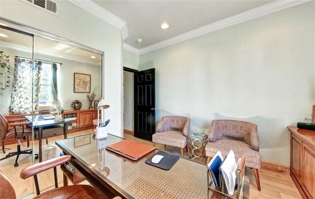 office area featuring visible vents, recessed lighting, crown molding, light wood finished floors, and baseboards