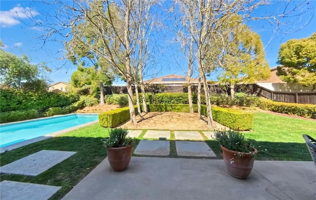 exterior space with a patio area, a fenced in pool, and a fenced backyard