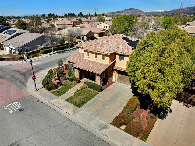 drone / aerial view featuring a mountain view and a residential view