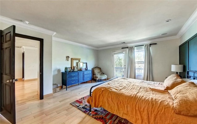 bedroom featuring light wood-type flooring, baseboards, and crown molding