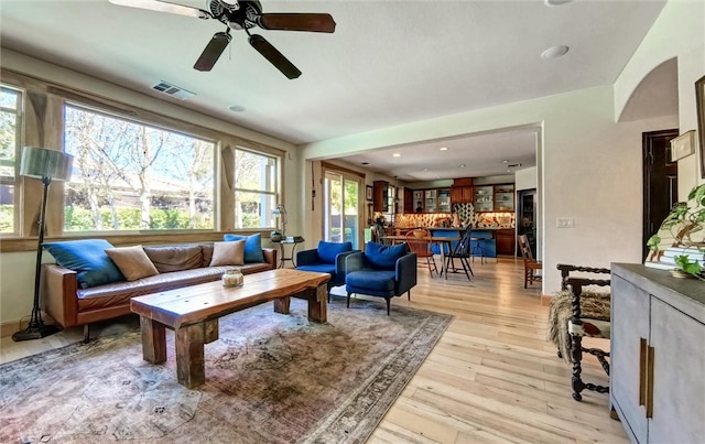 living room featuring visible vents and light wood-type flooring