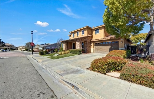 view of front of property with driveway, an attached garage, stucco siding, stone siding, and a tiled roof