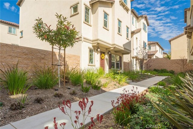 view of property with fence and a residential view