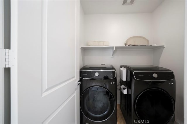 laundry area featuring laundry area and washer and clothes dryer