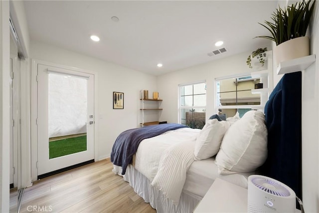 bedroom with access to outside, light wood-style flooring, recessed lighting, and visible vents