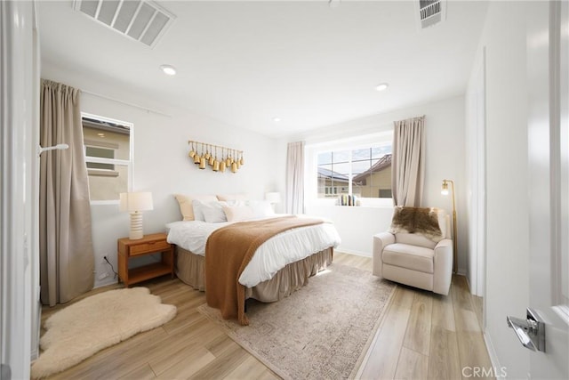 bedroom with recessed lighting, visible vents, and light wood finished floors