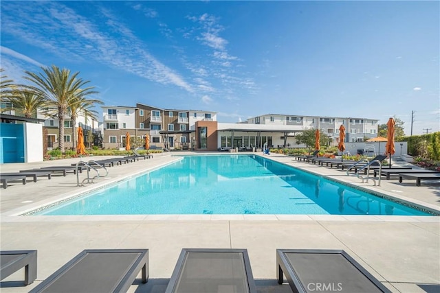 community pool with a patio area