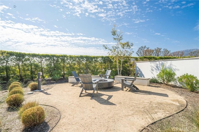 view of patio with an outdoor fire pit