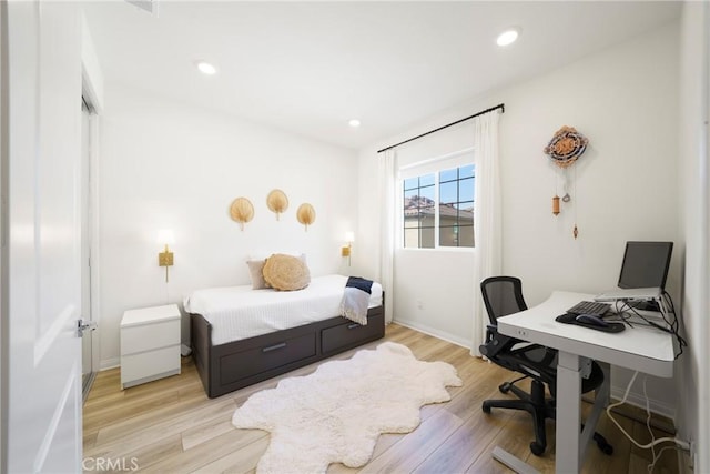 bedroom featuring light wood-style flooring, recessed lighting, and baseboards