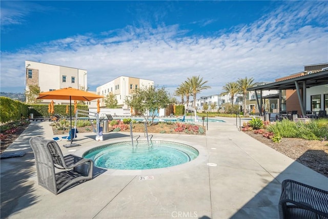 view of swimming pool with a residential view and a patio