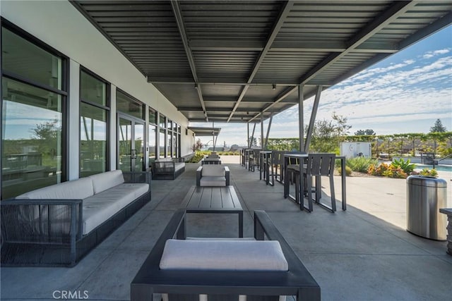 view of patio with outdoor lounge area and outdoor dining area