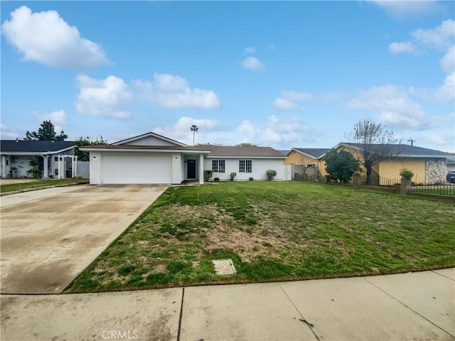 ranch-style home with driveway, an attached garage, a front yard, and fence