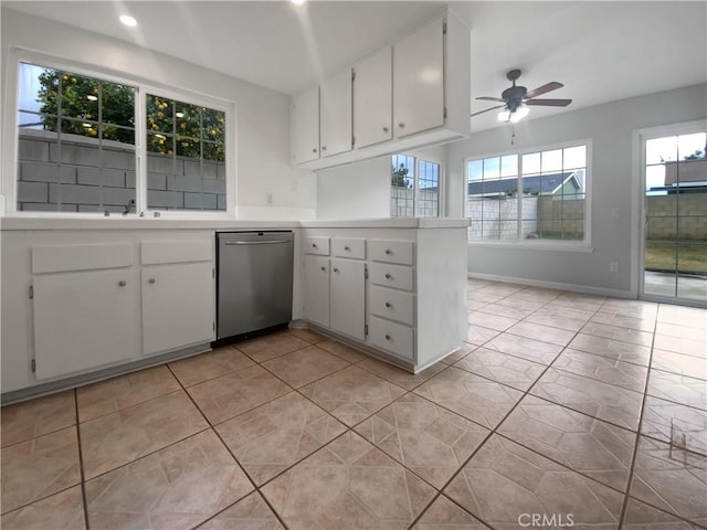 kitchen featuring a ceiling fan, stainless steel dishwasher, white cabinetry, a peninsula, and light countertops