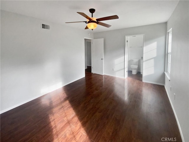 unfurnished bedroom featuring visible vents, ceiling fan, baseboards, and wood finished floors