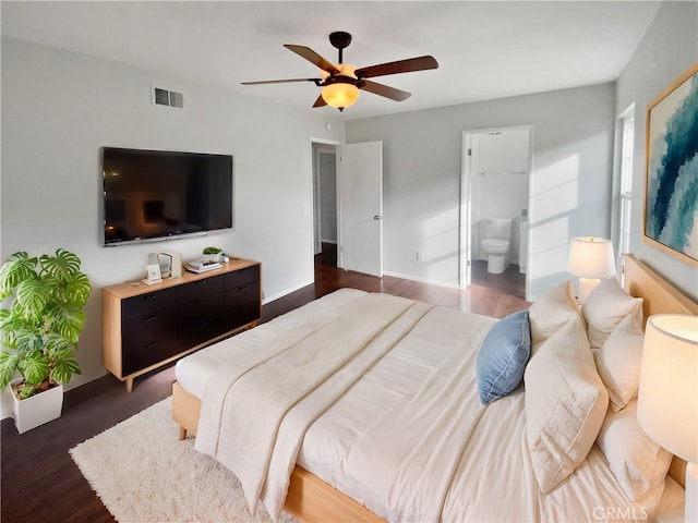 bedroom featuring visible vents, connected bathroom, baseboards, dark wood finished floors, and a ceiling fan