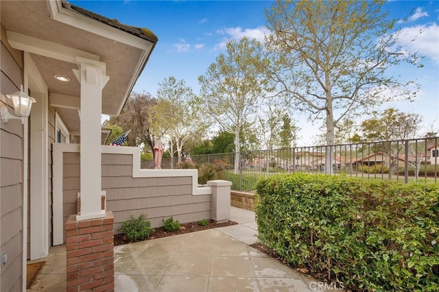 view of yard featuring fence and a patio area