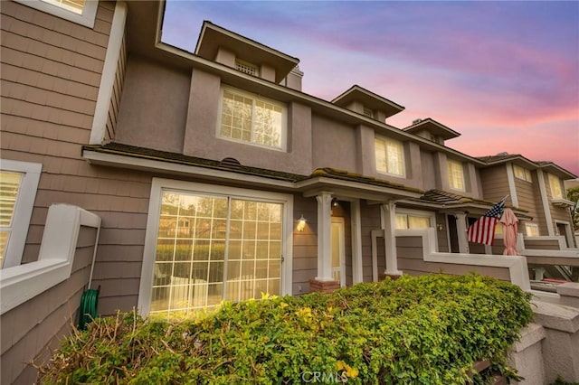 exterior space featuring stucco siding