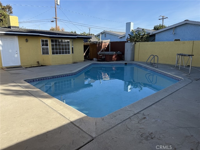 view of swimming pool with a fenced in pool, fence, and a patio area