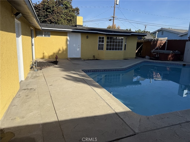 view of swimming pool with a fenced in pool, a patio, and fence