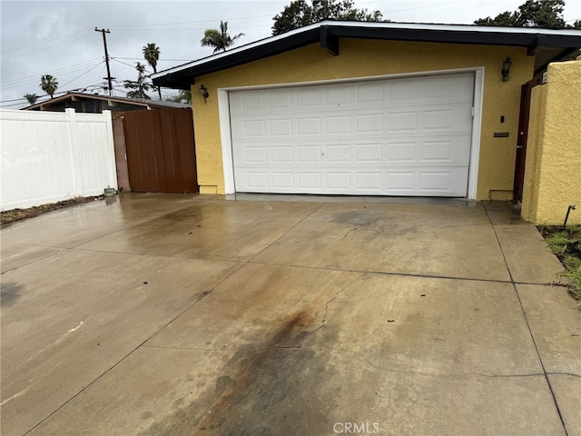 garage featuring fence