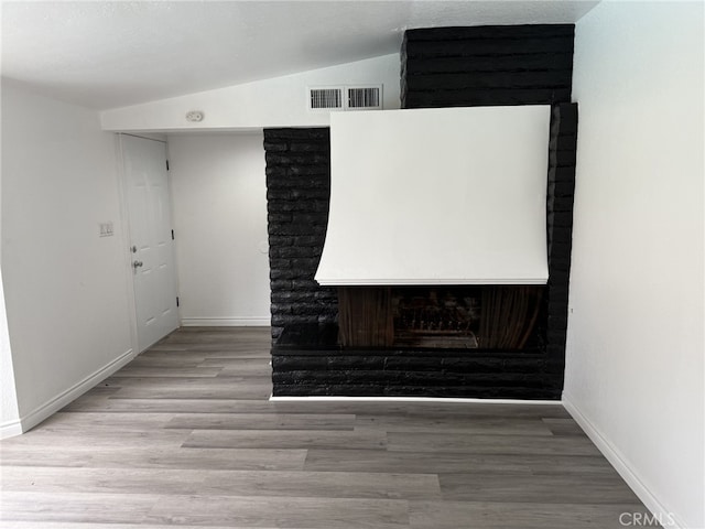 interior details with visible vents, baseboards, and wood finished floors