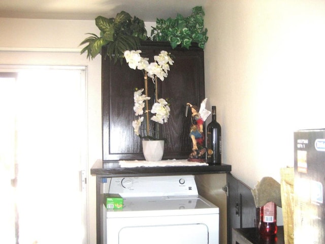 laundry room with laundry area and washer / clothes dryer