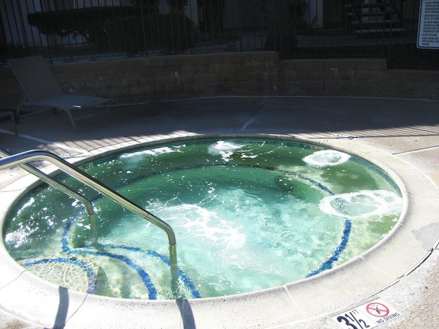 view of pool featuring a community hot tub