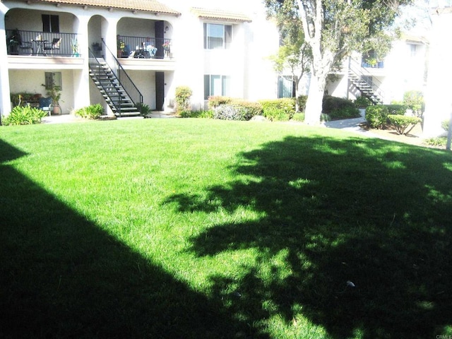 view of yard featuring stairway