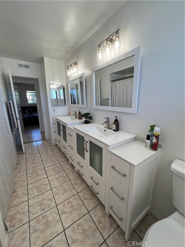 full bath featuring tile patterned flooring, visible vents, toilet, and vanity