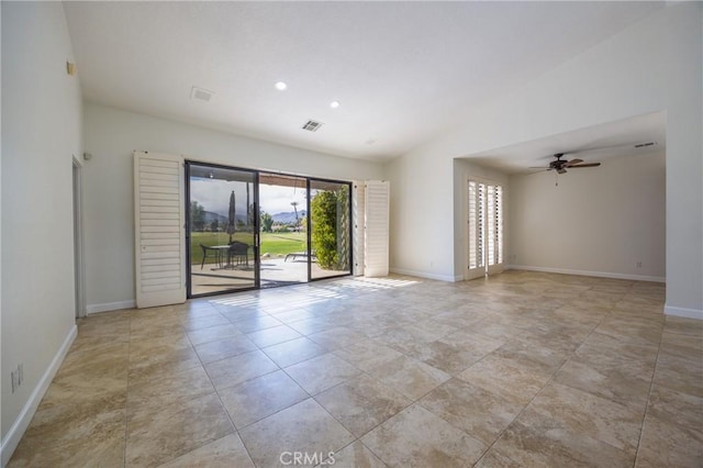 spare room with visible vents, baseboards, lofted ceiling, recessed lighting, and ceiling fan