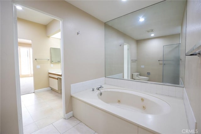 bathroom with tile patterned flooring, visible vents, a jetted tub, toilet, and vanity