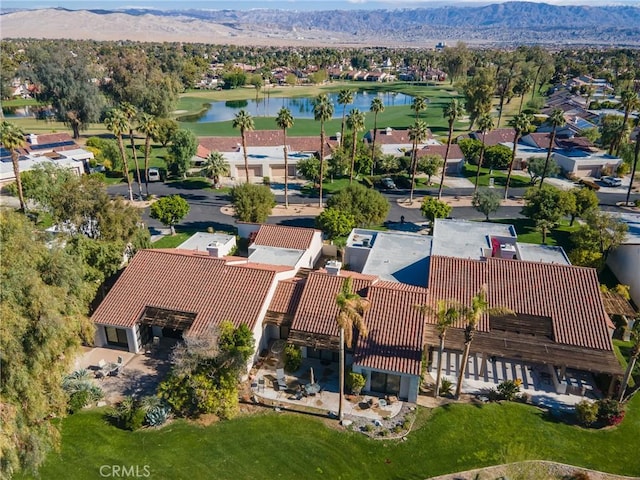 aerial view featuring a residential view and a water and mountain view