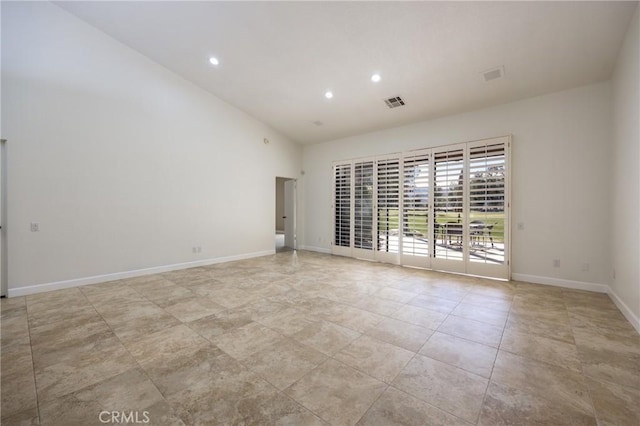 spare room featuring recessed lighting, visible vents, and baseboards