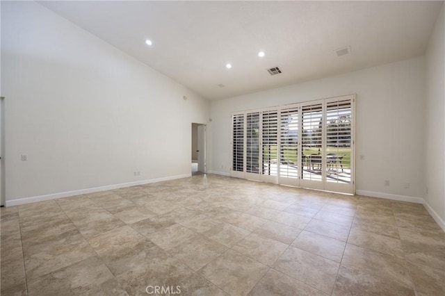 empty room with baseboards, visible vents, and recessed lighting