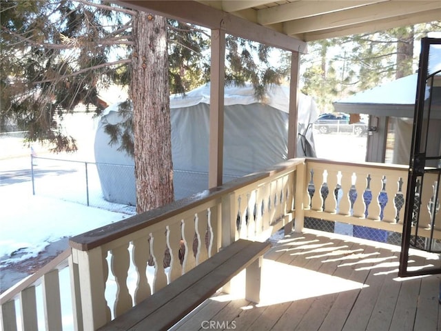 view of snow covered deck