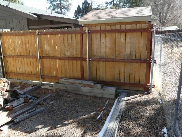 view of gate with fence