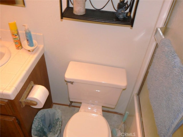 full bathroom with vanity, toilet, and a shower with shower door