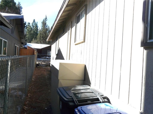 view of home's exterior with fence