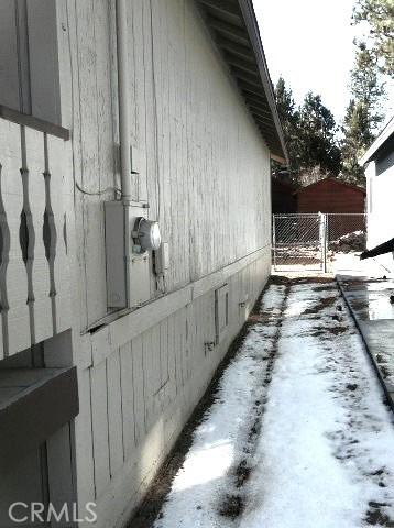 view of home's exterior featuring fence